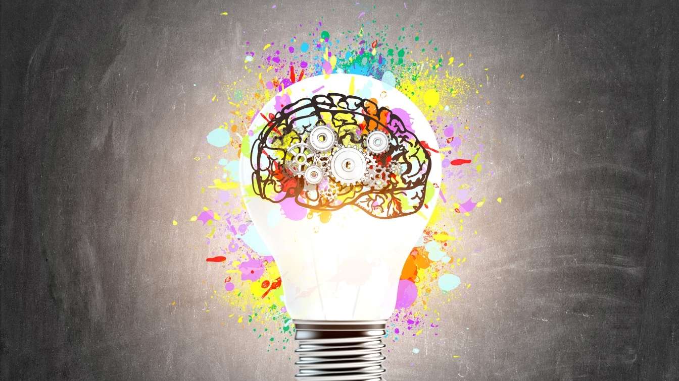 Brain inside lightbulb showing understanding