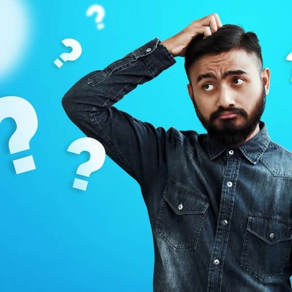 Man scratching head with question marks floating around him